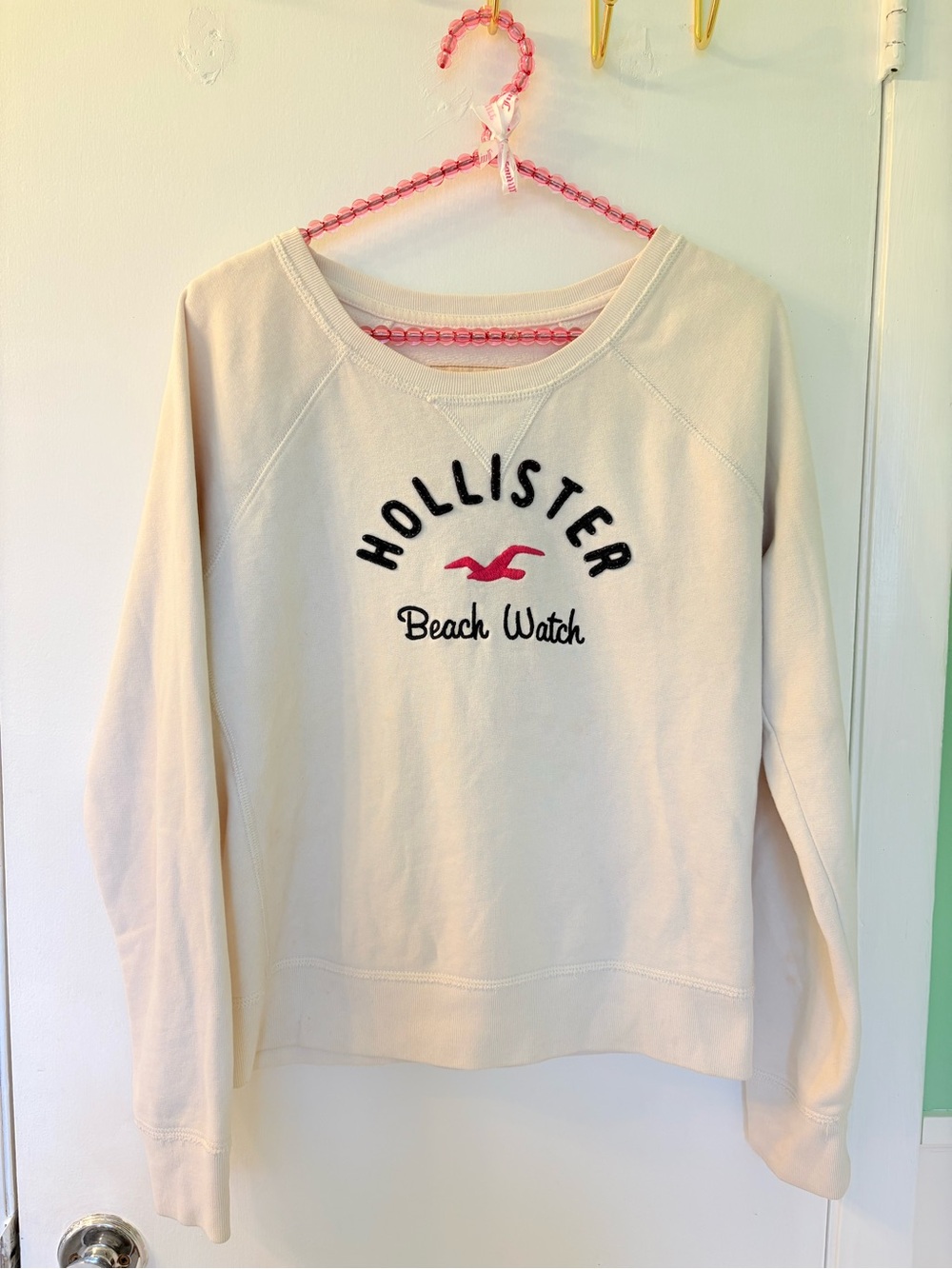 Hollister Cream Crewneck Sweatshirt with Pink Logo